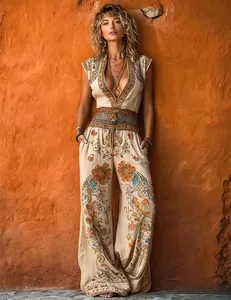 Detailed view of boho-style cream jumpsuit with vibrant ethnic floral print and wide legs.