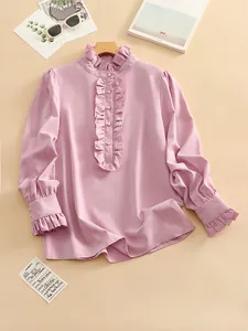 Elegant pink long-sleeved women's blouse featuring a ruffled collar and pearl buttons