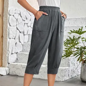 Detail of women's charcoal cotton linen cropped pants with elastic waist and pockets.