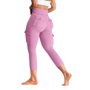 Detailed view of pink cargo yoga pants with high-waisted peach lift design