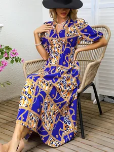 Fashionable blue maxi dress with gold chain and leopard print, v-neck and puff sleeves