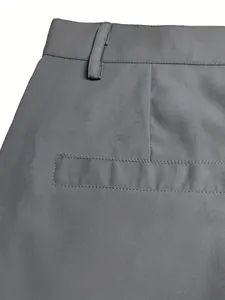 Detail view of men's grey casual outdoor shorts waistband and welt pocket stitching.