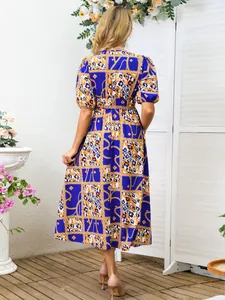Rear view of a stylish blue midi dress with leopard and chain print pattern