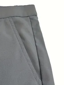 Close-up detail of gray cotton casual shorts showing fine stitching and fabric texture