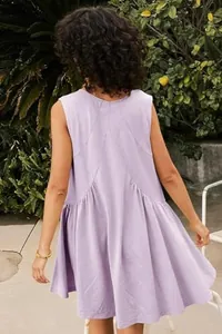 Back view of a casual lavender sleeveless ruffled hem mini dress in outdoor setting