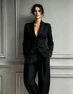 Sophisticated black single-breasted blazer paired with fluid wide-leg trousers suit set.