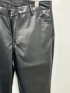 Detailed view of men's slim fit PU leather pants showing waist button and zipper