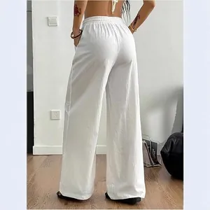 Stylish women's white cotton linen wide-leg pants with elastic high waist for summer wear