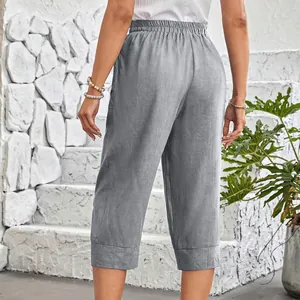 Back view of grey cotton linen loose cropped pants with a comfortable elastic waist
