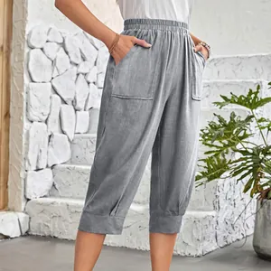Detail view of women's gray cotton linen cropped pants featuring an elastic waist