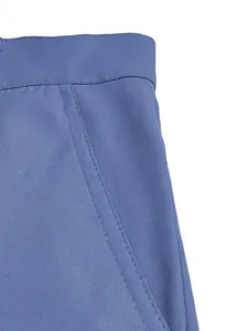 Close-up detail of the durable stitching and waistband on men's blue cotton casual shorts.
