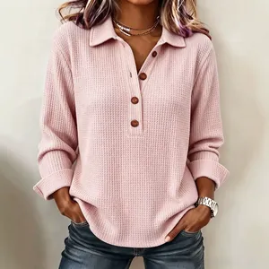Elegante polo a maniche lunghe da donna in maglia a nido d'ape rosa con bottoni