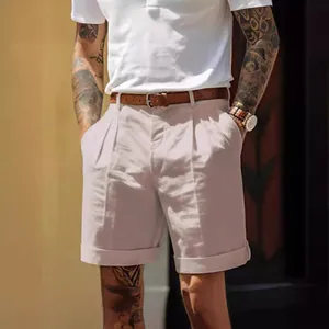 Men's pleated linen shorts in a light beige, styled with a leather belt for summer.