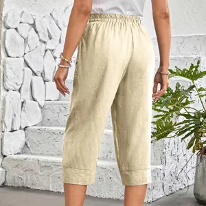 Detail view showing the back fit and texture of beige cotton linen cropped casual pants.
