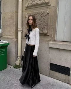 Elegant white sequined long sleeve cropped jacket with black bow ties for women
