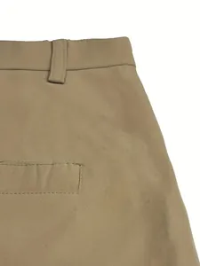 Detailed close-up showing the waistband and back pocket of khaki men's cotton shorts.