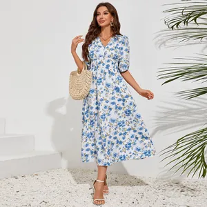 Full view of elegant V-neck midi dress with blue floral print and puff sleeves
