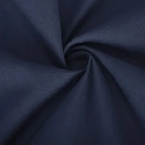 Close-up macro view of navy blue cotton linen woven fabric texture for casual trousers