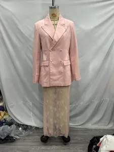 Full-length view of a pink double-breasted blazer and lace skirt on a mannequin