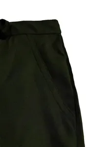 Close-up view of dark olive green men's shorts showing side pocket and durable fabric texture