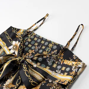 Close-up of vintage chain print satin camisole with bow detail and adjustable straps