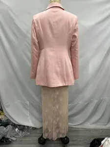 Back view of an elegant pink waist-cinched blazer and beige floral lace maxi skirt set.