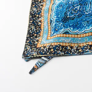 Detail of vintage paisley printed silk-like fabric with tie-up straps for halter top.