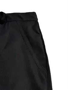Close-up of the stitching and fabric on black men's outdoor leisure cotton shorts