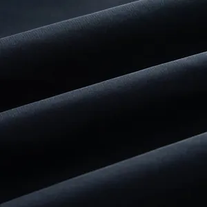 Close-up detail of high-quality woven fabric texture for women's short trench coat