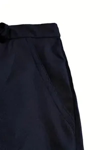 Close-up detail of stitching and pocket on men's navy cotton outdoor casual shorts
