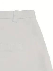 Close-up view of white cotton leisure shorts showing the belt loop and pocket detail