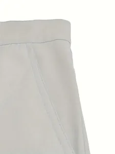 Detail view of stitching and fabric texture on light grey men's cotton casual shorts