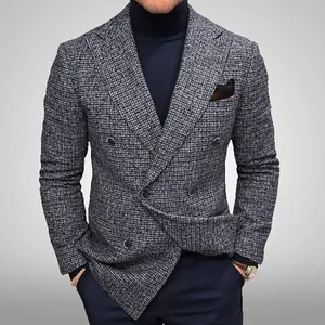 Detail view of a men's grey houndstooth double-breasted blazer with classic styling