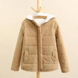 Detail view of khaki quilted winter coat with white fleece lined hood for women.