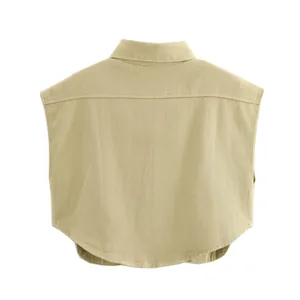 Macro view of the back of a khaki sleeveless faux denim polo shirt with curved hem