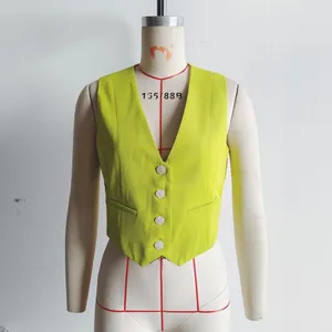 Close-up detail of a women's chartreuse slim-fit V-neck vest on a white mannequin.