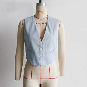 Detailed front view of a light blue V-neck slim fit tailored waistcoat vest on mannequin