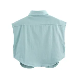 Back view detail of a mint green sleeveless denim style shirt featuring a polo collar