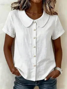 Detail view of white cotton linen short sleeve shirt featuring a Peter Pan collar