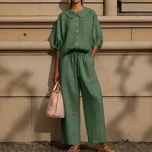 Full view of women's sage green linen set with puff sleeve shirt and drawstring pants
