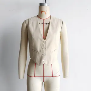 Close-up detail of a beige V-neck slim fit waistcoat vest on a tailor's dress form.