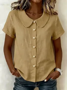 Detail view of khaki cotton linen shirt with Peter Pan collar and pearl buttons