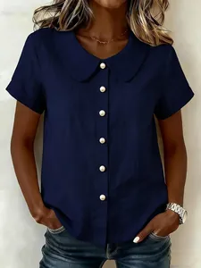 Detail of navy blue short-sleeve cotton linen shirt with elegant Peter Pan collar