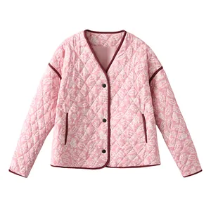 Women's pink quilted cotton jacket featuring a detailed white paisley floral print