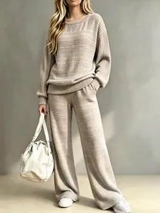 Detailed view of women's ribbed knit two-piece set in beige with wide-leg pants
