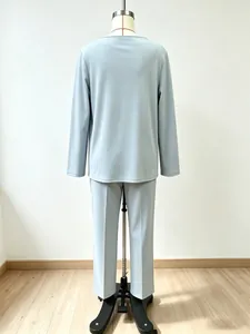 Elegant two-piece light blue lounge set with long-sleeved top and trousers