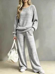 Close-up of stylish gray ribbed knit lounge set with wide-leg pants and long-sleeve top