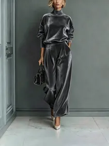 Fashionable grey velvet two-piece set featuring high-neck top and wide-leg trousers