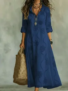 Detail of blue long-sleeved maxi dress featuring 3D digital floral print and V-neckline