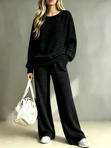 Detailed texture of black ribbed knit lounge set with wide leg pants for women